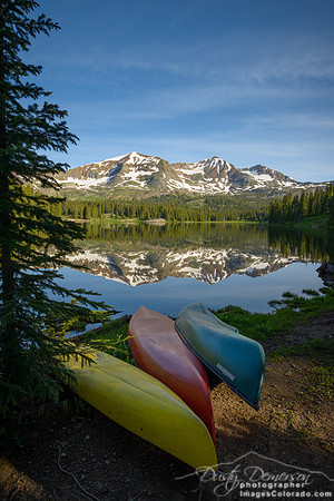 The Ruby Range is a mirror reflection in Lake Irwin on a summer morning